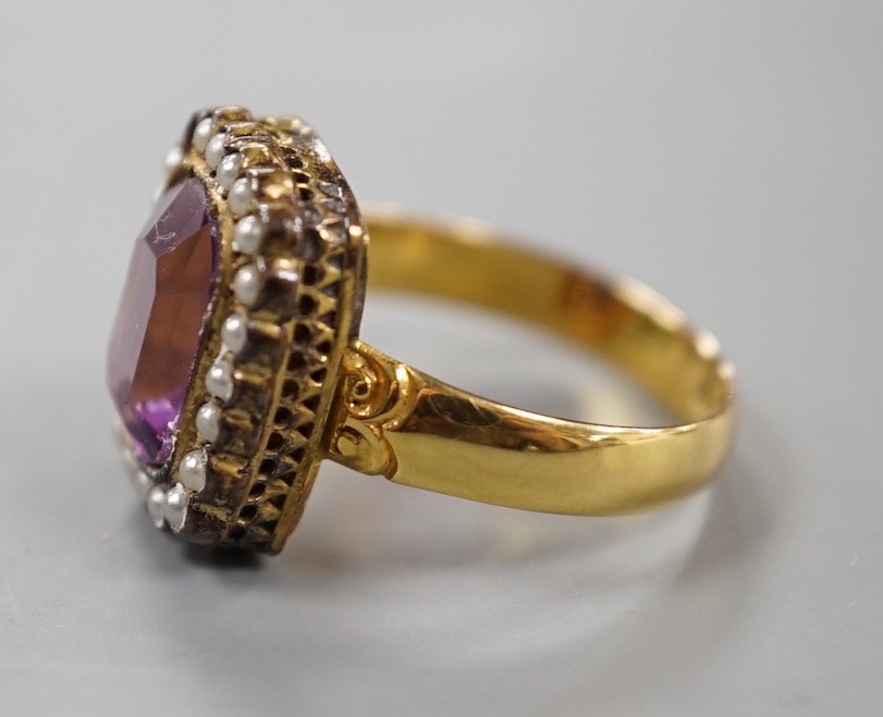 A Victorian 18ct gold, amethyst paste and simulated split pearl cluster set dress ring, size M, gross weight 4.5 grams.